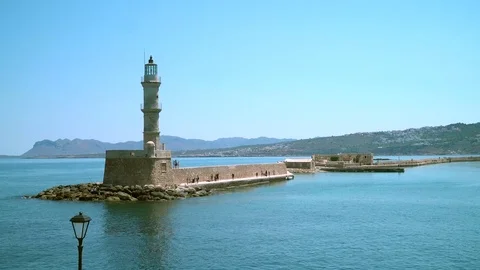 Sea lighthouse in front of the harbor. 動画素材 79991754