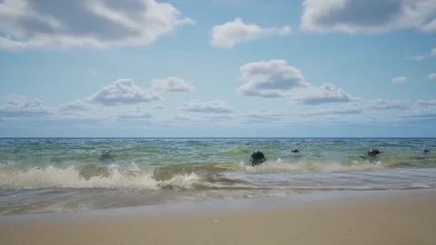 Sea mines float on the waves at sunset Stock Footage 269698398