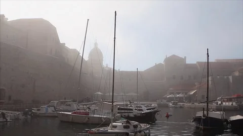 A sea mist flows through the old port in the Dubrovnik's old town 動画素材 74025186
