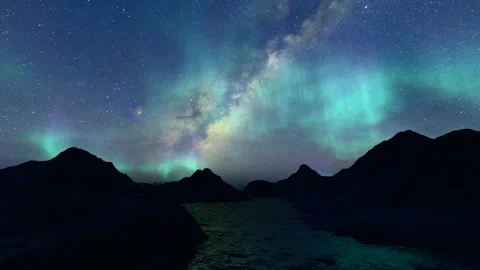 Sea mountains night starry sky northern lights Stock Footage 240150221