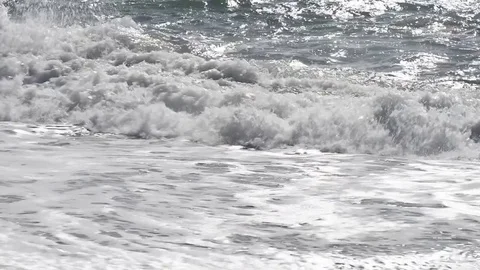 The sea moved by the strong wind crashes with strong waves on the beach Video stock 84025219