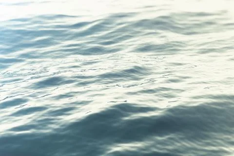 Sea, ocean wave close-up sunset, low angle view, cross processing effect. Hard Stock Illustration