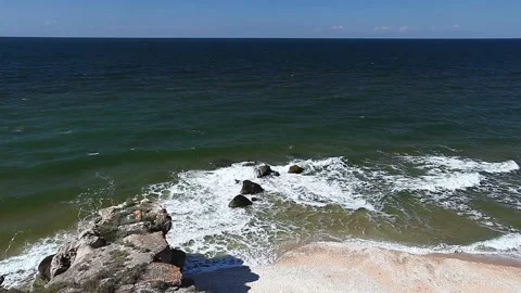 Sea or ocean, surf on a sandy coast with rocks Stock Footage 136535285