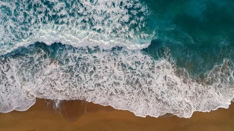 Sea or ocean surf wave. Foamy ocean waves rolling and coming on a sand beach Stock Footage 103457058