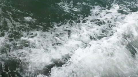 Sea or ocean waves and foam after motor boat or yacht Stock Footage 99468995