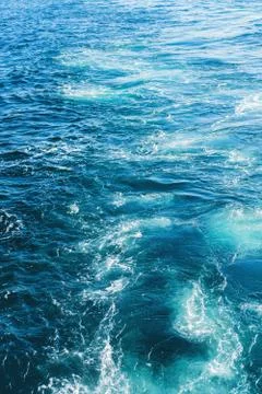 Sea or ocean waves surface texture. Abstract summer blue water background with Stock Photos