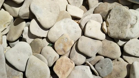 Sea or river pebbles. Smooth stones dried in the sun Stock Footage 197487308