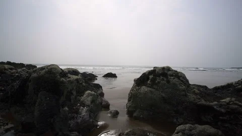 Sea Or River Water - Medium To Calm Waves Hitting A Rock Shore Stock Footage 261518950