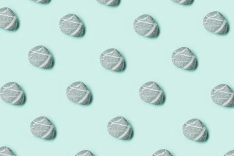 Sea pebble pattern on pastel mint background Stock Photos