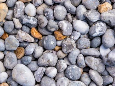 Sea pebbles background Stock Photos