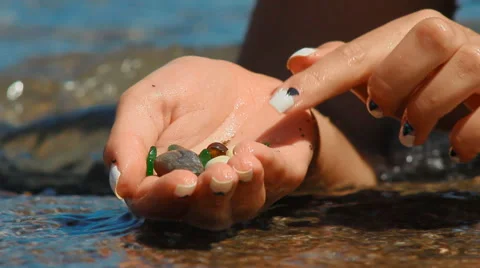 Sea pebbles in the palm Stock Footage 65448549