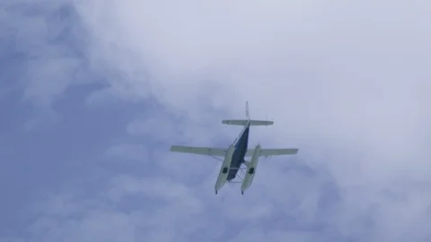 Sea Plane Flies Through Sky Overhead Slow Motion 1 Stock Footage 100535076