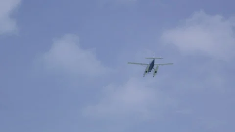 Sea Plane Flies Through Sky Overhead Slow Motion 2 Stock Footage 100535535