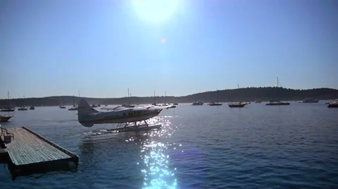 Sea Plane in Marina, Air Float Plane, Lens Flare Stock Footage 37879993