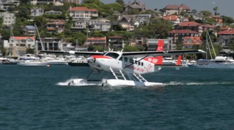 Sea plane moving through water in a bay Stock-Footage 59643607