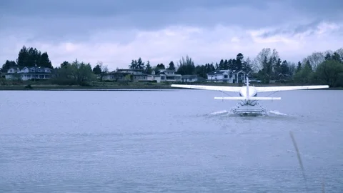 Sea plane moving water surface wide shot Stock Footage 98569369