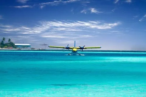 Sea plane taking off in ocean Stock Photos