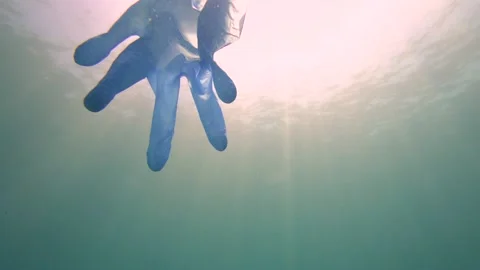 Sea is Polluted with Single Use Gloves Stock Footage 144895579