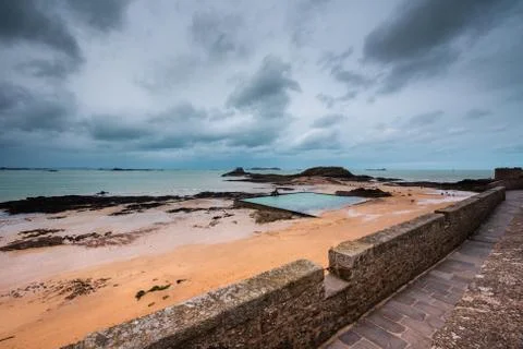Sea pool on an empty beach of Saint Malo Stock Photos
