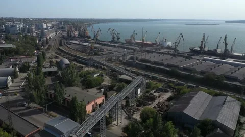 Sea port. loading the vessel at the berth. The camera flies to the ship while Stock Footage 157636854
