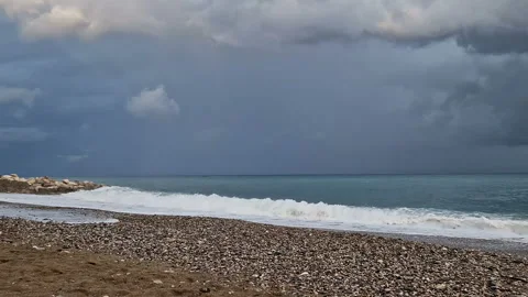 The sea before the rain, big waves, windy weather, cold, cloudy sky. Stock Footage 289615193