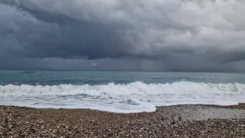 The sea before the rain, big waves, windy weather, cold, cloudy sky. Stock Footage 289615283