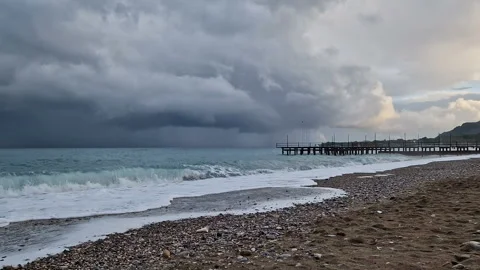 The sea before the rain, big waves, windy weather, cold, cloudy sky. Stock Footage 289615690