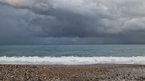 The sea before the rain, big waves, windy weather, cold, cloudy sky. Stock Footage 289616076