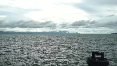 Sea before the rain. Black clouds and mountains. Stock Footage 140237451