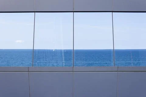 Sea reflected in the windows. Stock Photos
