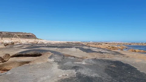 Sea rock pool and ocean Stock Footage 101044282