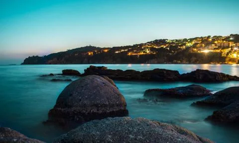 Sea rocks at dusk Stock Photos