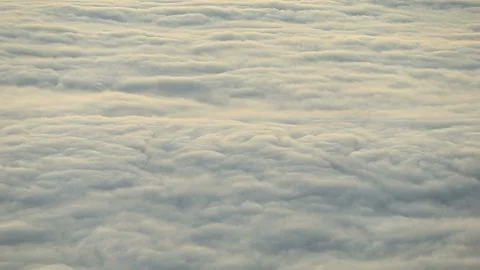 Sea of Rolling Inversion Clouds at Sunrise Stock Footage 99529702