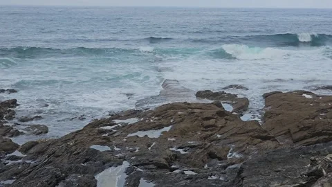 The sea rolling in onto rocks Video stock 244522930
