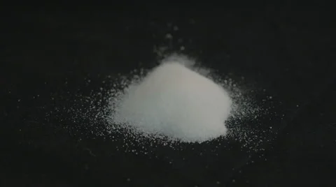 Sea salt with black background Stockbeeldmateriaal 43240636