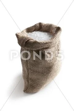 Sea salt in jute sack Stock Photos