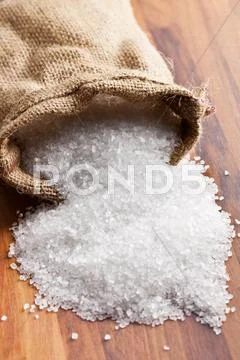 Sea salt in jute sack Stock Photos