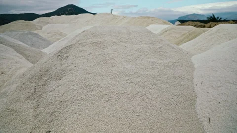 Sea salt piles rows placed outdoors nearsolar evaporation pond closeup Video stock 318721316