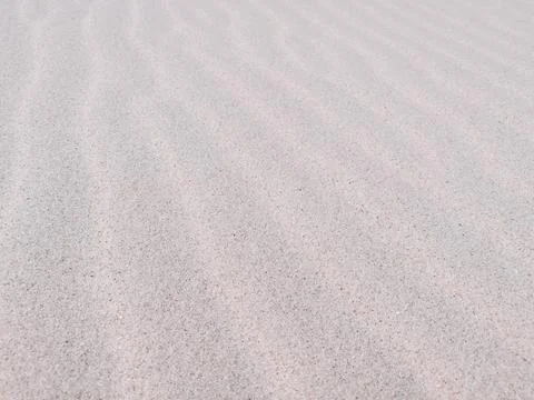 Sea sand with wavy pattern. Sandy texture natural background 写真素材