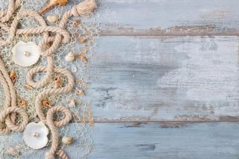 Sea shells in a fishnet Stock Photos