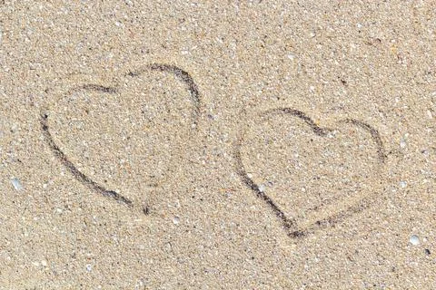 Sea shells on sand. Summer beach background. Top view Stock Photos