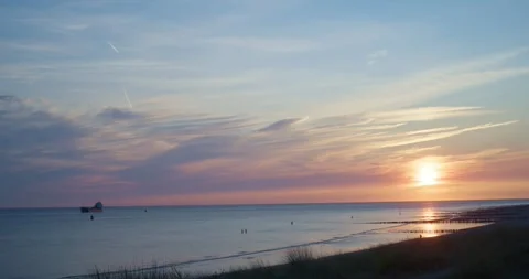 Sea shore and beach with setting sun in the evening Stock Footage 334632647