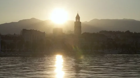 Sea side of Split city of Croatia at surise with mountains in the background Stock Footage 83744220