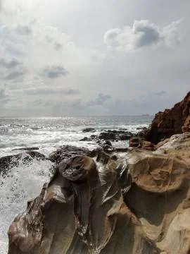 Sea splashes on the rocks Stock Photos