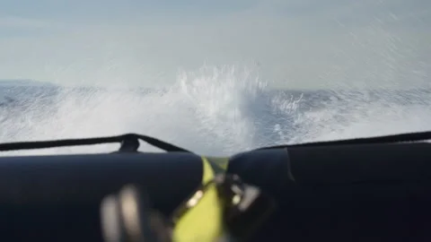 Sea spray from the back of a small boat to St Kilda, Scotland Stock Footage 229334704