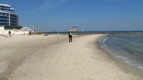 The Sea In The Spring. The Sandy Beach And A Modern Building In The Distance. Stock Footage 88992608