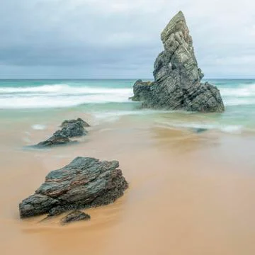 Sea stack and beach 库存照片