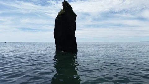 Sea Stack and Calm Sea at Ballydwan Beach Waterford Ireland Видео 337396365