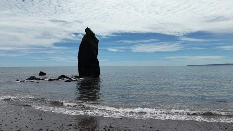Sea Stack and Calm Sea at Ballydwan Beach Waterford Ireland Stockbeeldmateriaal 337397036