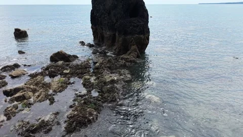 Sea Stack and Rocky Shore at Ballydwan Beach Waterford Ireland Stock Footage 337397746
